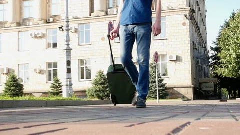 Man throw camera with suitcase baggage. Legs close up outdoors footage Stock Footage 111957305