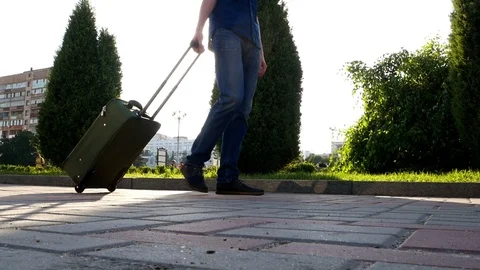 Man throw camera with suitcase baggage. Legs close up outdoors footage Stock Footage 112000194