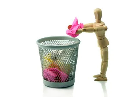 Man throw crumpled paper in trash can Stock Photos