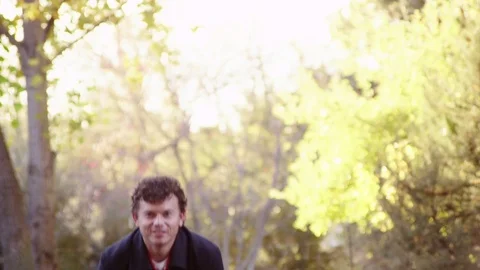 Man throwing autumn leaves Stock Footage 80185098