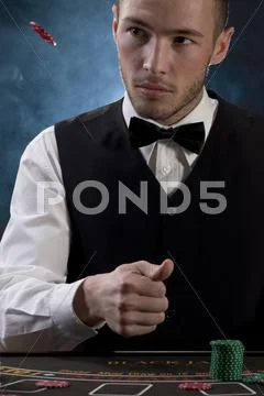Man throwing away chip Stock Photos