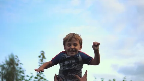 Man Throwing A Baby In The Air Stock Footage 80237944