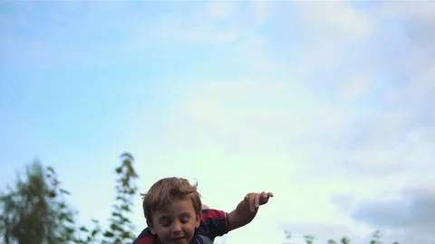 Man Throwing A Baby In The Air Stock Footage 80237961