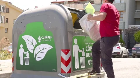 Man Throwing Big In Garbage Container Stock Footage 65478143