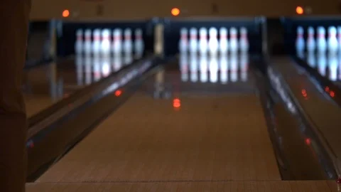 Man throwing a bowling ball to down a lane to pins. Stock Footage 100649201