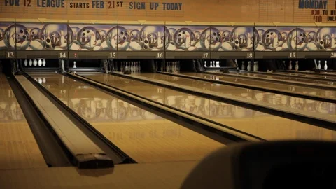 Man Throwing Bowling Ball down Lane into Gutter Stock-Footage 114015999