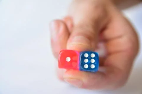 Man throwing colored dice blur  on white background Stock Photos