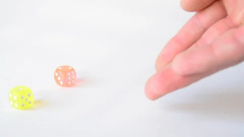 Man throwing colored dice on white background Stock Footage 91220091