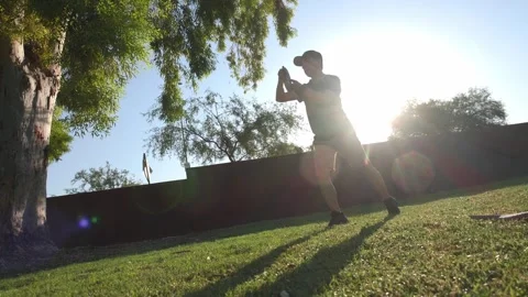 A man throwing a disk on a disk golf course Stock Footage 247081493