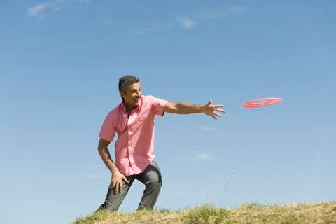 Man throwing flying disc Stock Photos