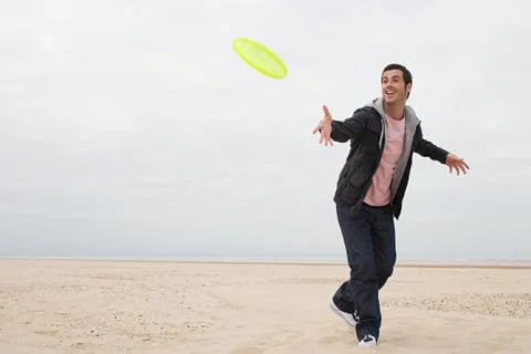 Man throwing a flying disc Stock Photos