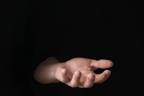 Man throwing game dices on black background, closeup. Space for text Stock Photos
