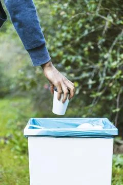 Man throwing up garbage bin Stock Photos