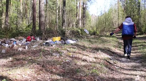 Man throwing garbage in the woods Stock-Footage 50962572