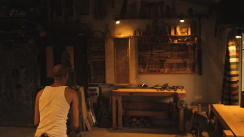 Man throwing knives at target indoors Stock Footage 275628941
