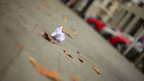Man throwing a paper in the street Stock Footage 69919254
