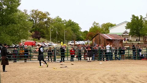 Man Throwing Shot Put at Celtic Festival Highland Games Stock Footage 117958052