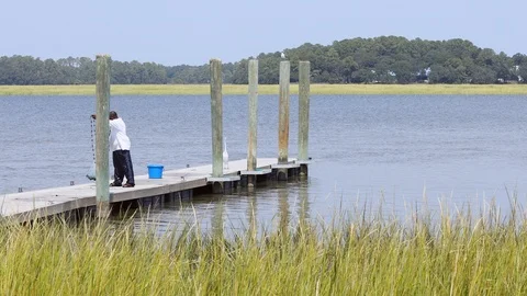 Man throwing a shrimp net Stock Footage 118931826