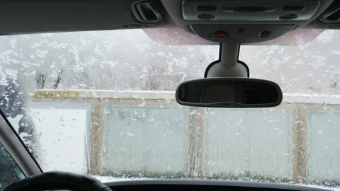 Man throwing snowball on windshield. Winter time Stock Footage 95803400