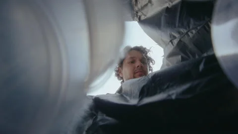 Man Throwing Sorted and Cleaned Plastic into Trash Can Stock-Footage 236983131