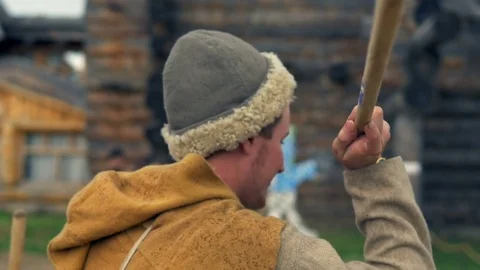 Man is throwing a spear at the target Stock Footage 82406104