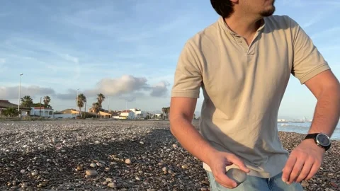 Man throwing stone Stock Footage 261672450