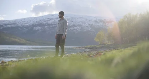 Man throwing stone in river Stock Footage 85835249