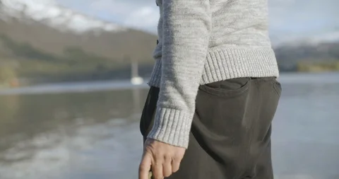 Man throwing stone in river Stock Footage 85835375