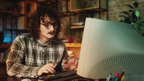 Man throwing a tantrum after struggling with computer project in retro workplace Stock Footage 315456039