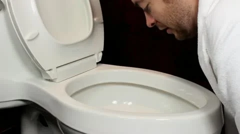 Man throwing up in toliet V2 - HD Video stock 12244164