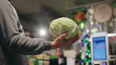 A man throws up and catches a cabbage swing with his hand Stock Footage 259296848