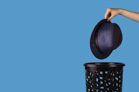 The man throws away old clothes. Stock Photos