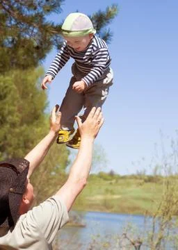 A man throws up baby Stock Photos