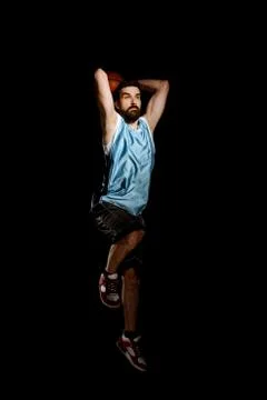 Man throws a ball overhead. Professional basketball player Stock Photos