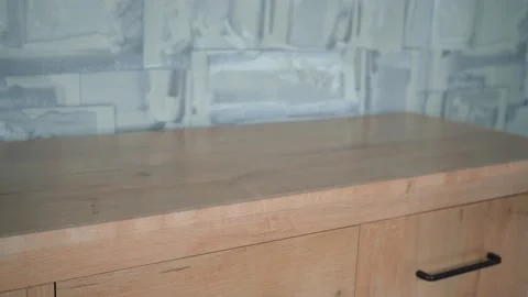 Man throws black notepad on dresser 스톡 동영상 145984170
