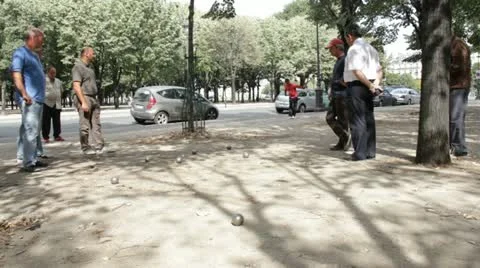 Man throws a boules in Paris Video stock 12565905