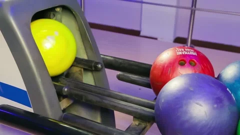 A man throws a bowling ball on the playing field and knocks pins Stock Footage 106523816