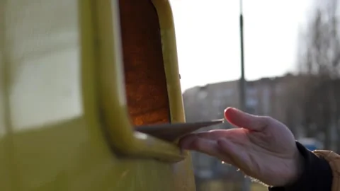 A man throws cardboard, paper into the trash bin for recycling. Stock Footage 267844634