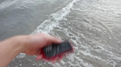 Man Throws Cell Phone Into Ocean Stock Footage 58836852