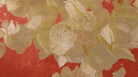 Man throws chips into the air Stock Footage 118133719