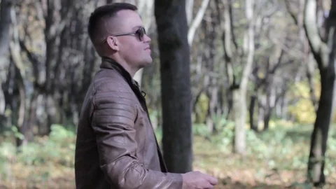 Man throws a coin in slow motion Stock Footage 81370567