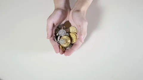 Man throws coins with bitcoins in palms in slowmotion Stock Footage 80893474