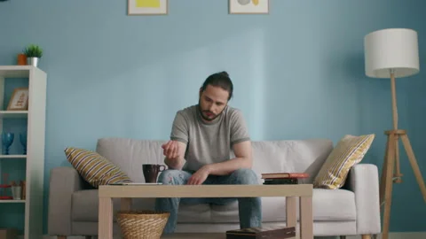 Man Throws Dice on Coffee Table Stock-Footage 130454743