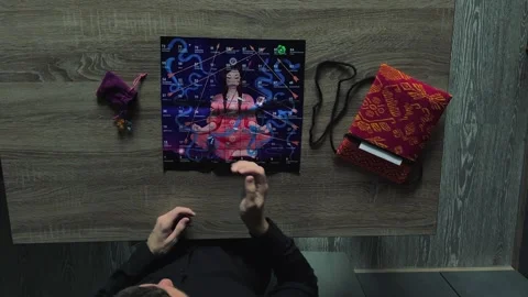 The man throws a die and starts making a move in the board game Lila Stock Footage 254259556