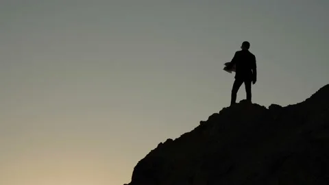 Man throws documents from a cliff Stock-Footage 91748054
