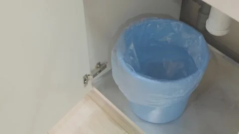 Man throws empty plastic bottle into trash Stock Footage 271070106