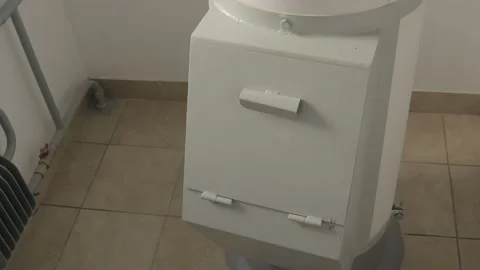 Man throws garbage in an apartment building Stock Footage 134336541