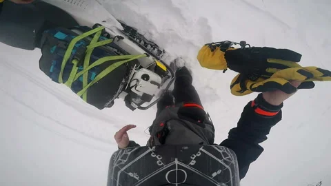 Man throws gloves on the snow and starts to take off his helmet Stock-Footage 102207536