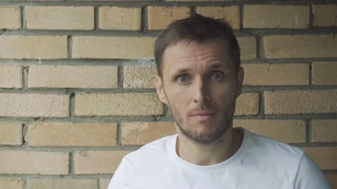 A man throws up his hands in surprise Stockbeeldmateriaal 156765075