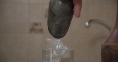 Man throws ice into a glass Stock Footage 130051447